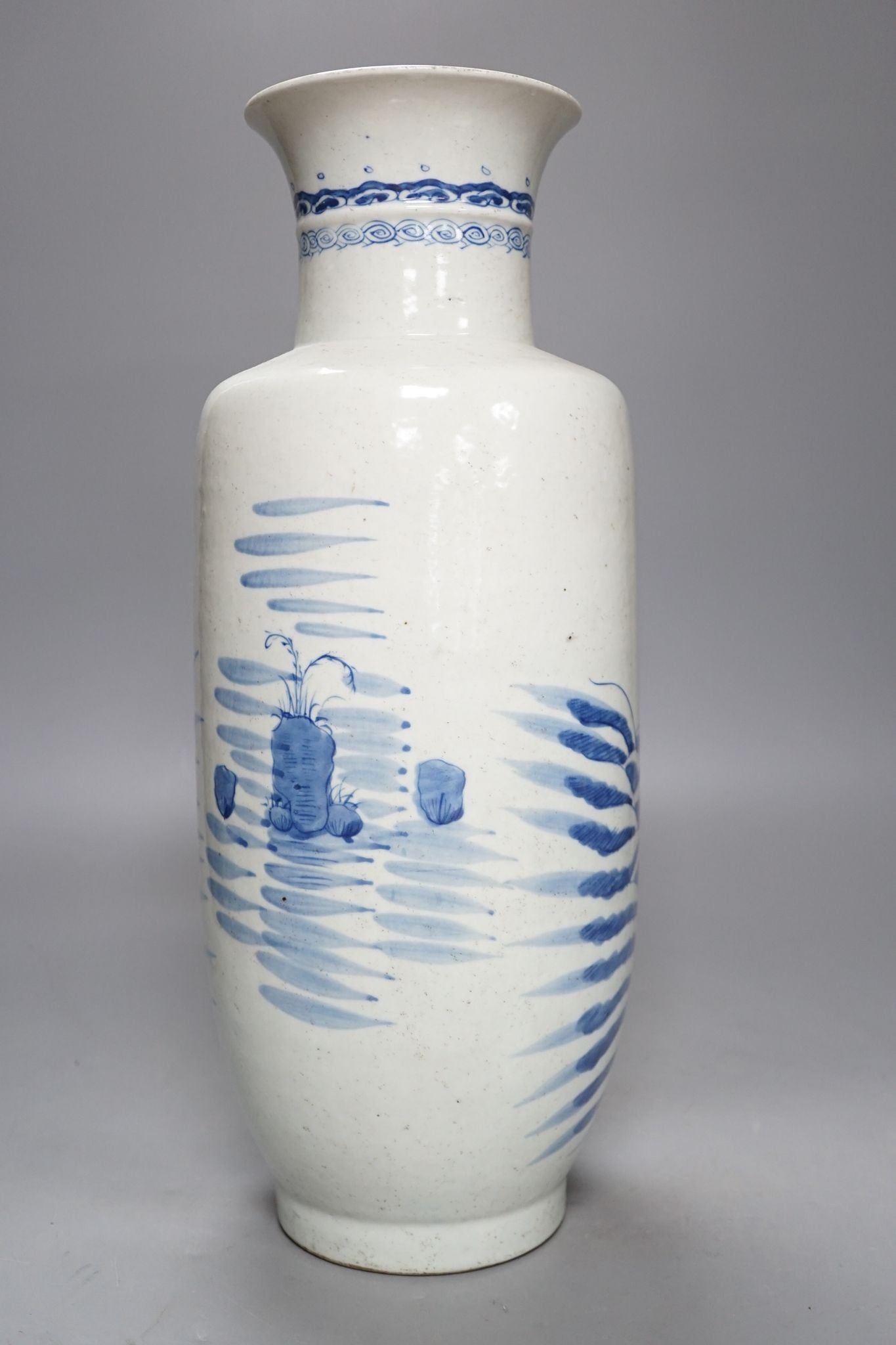 A Chinese blue and white rouleau vase, 42 cm